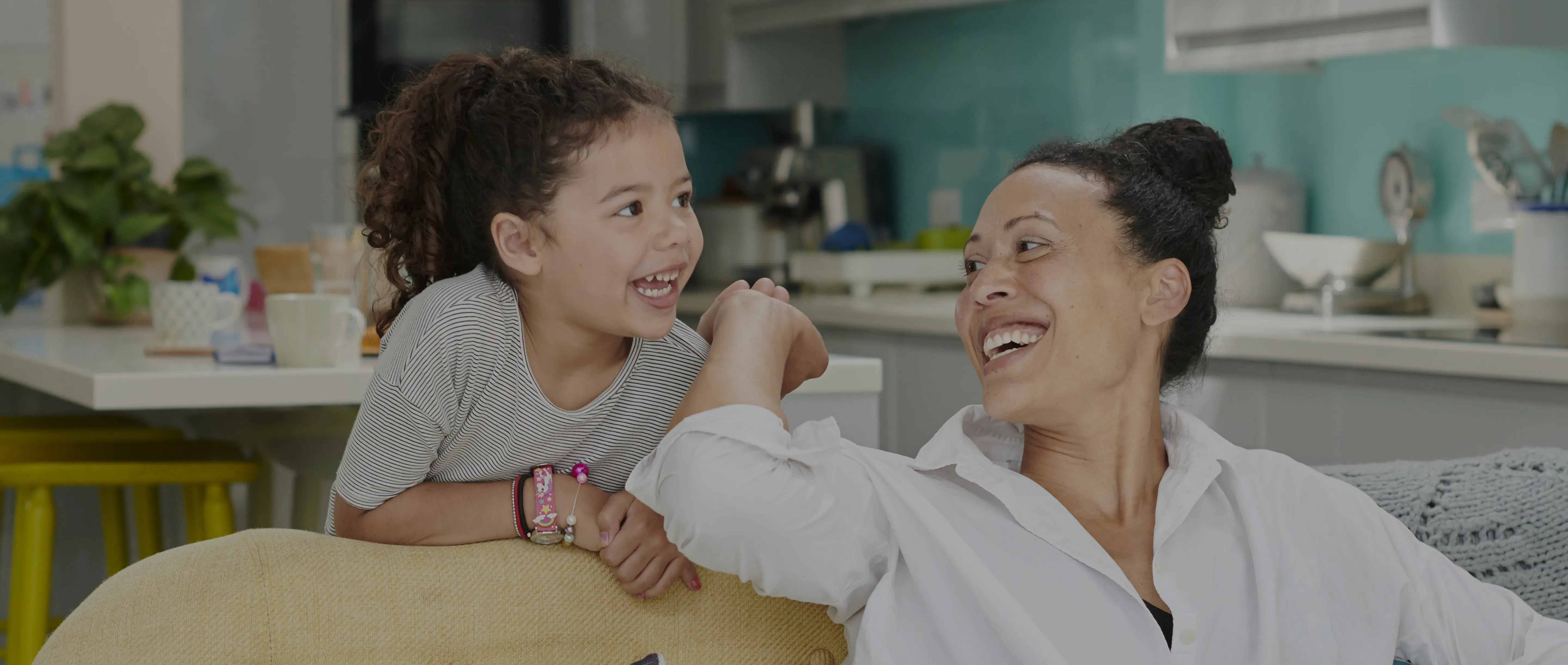 Mother and daughter holding hands